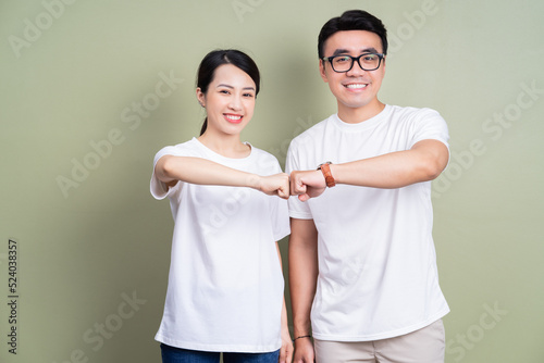 Photo of Asian couple on background