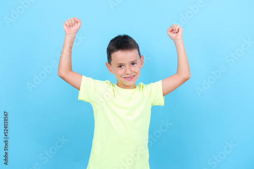 8-year-old boy is a winner and celebrates with his arms