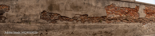 Panoramica di muro in mattoni rovinati in citt  
