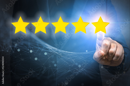Businessman pointing five star symbol to increase rating of company. Customer satisfaction and product service evaluation concept. Increase rating