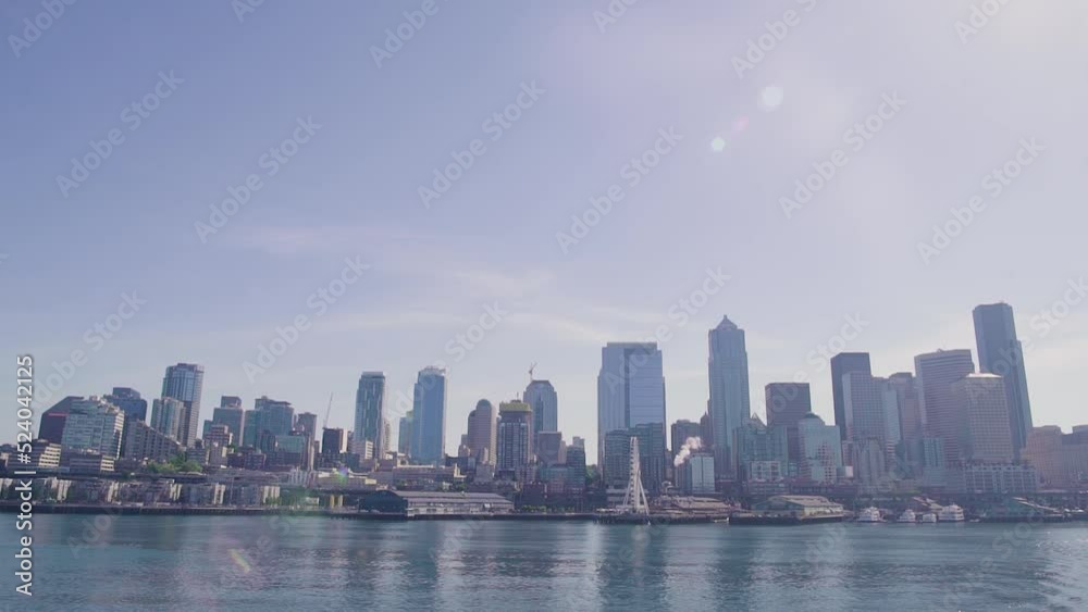 Sunny Seattle Washington city skyline from the puget sound in slow motion Sunny Seattle Washington city skyline from the puget sound in slow motion