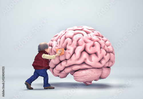 Old man cleaning a human brain. Mental health and dopamine concept. photo