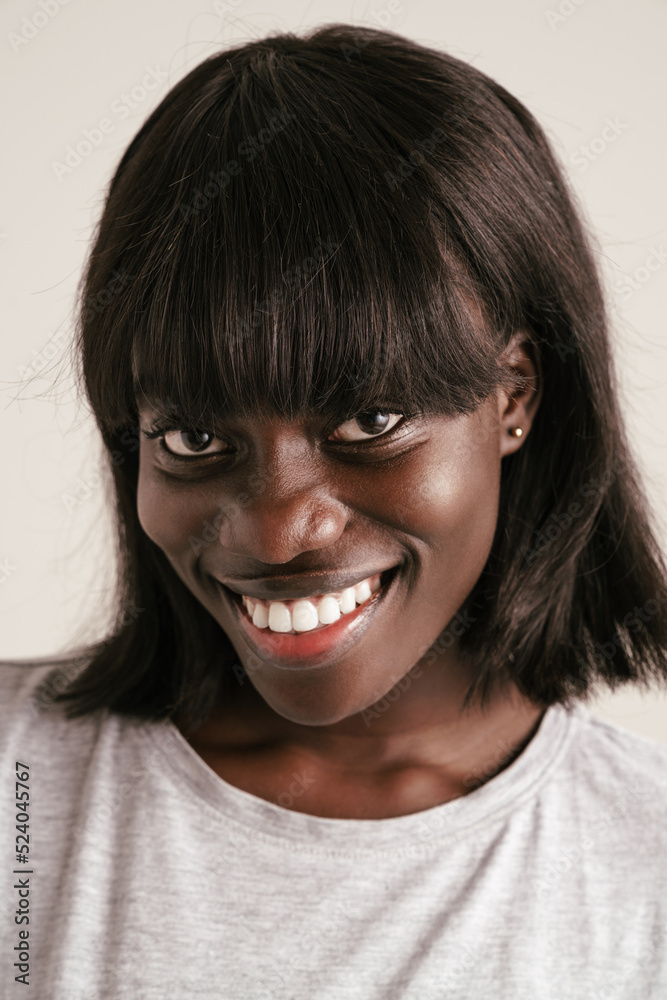 Portrait of young beautiful smiling african woman with bob haircut Portrait of young beautiful smiling african woman with bob haircut