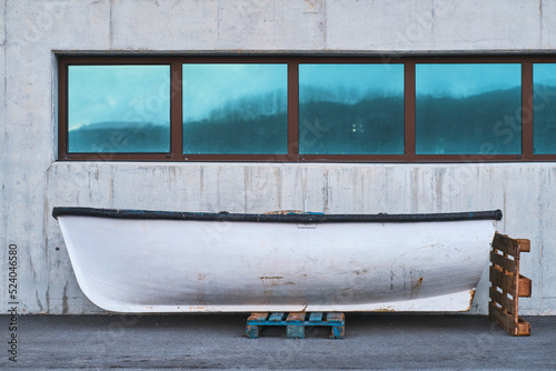 small boat stranded in port facilities.  photo