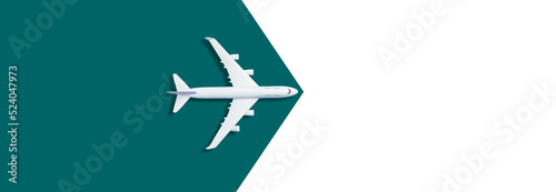 Model white plane, airplane on green background. Top view, flat lay. Travel, vacation concept.