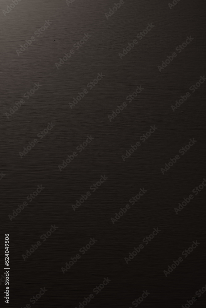 The white cement wall was in the dark and had a faint light.