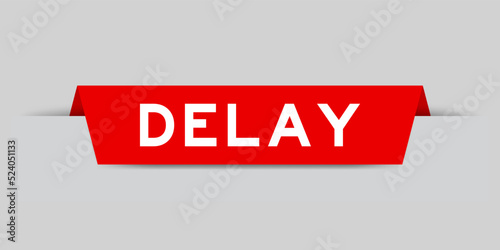 Red color inserted label with word delay on gray background