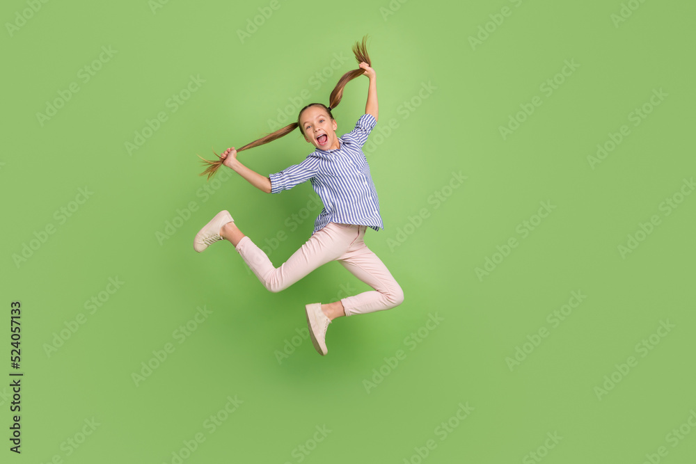 Photo of excited student age kid jump high touch haircut from hairdress salon isolated vivid color background