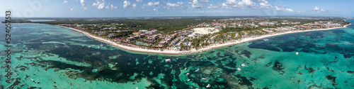 Punta Cana, Dominican Republic , panoramic aerial view around the area of Bávaro Beach with azure water, beach and tourist attractions - bird eyes view  photo