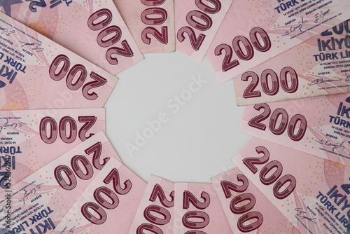 Turksh Lira banknotes of various color, pattern and value on white background	
 photo