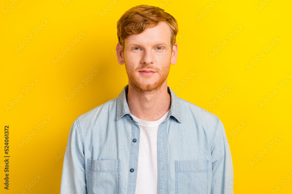 Photo portrait of handsome young man smiling looking camera shopping banner dressed trendy denim outfit isolated on yellow color background Photo portrait of handsome young man smiling looking camera shopping banner dressed trendy denim outfit isolated on yellow color background