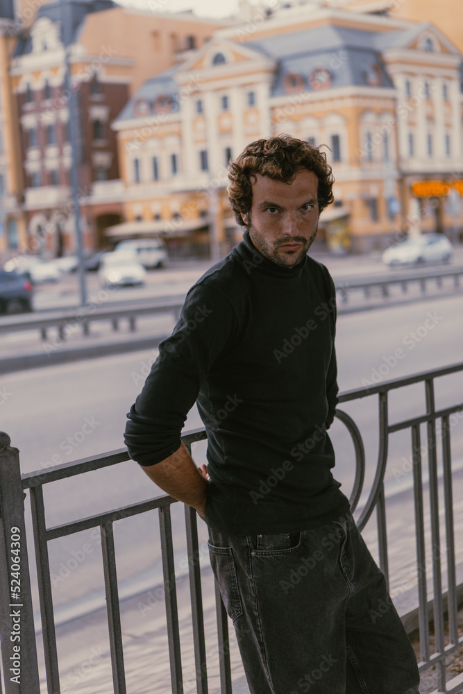 A stylish portrait of a charismatic man in the city A stylish portrait of a charismatic man in the city