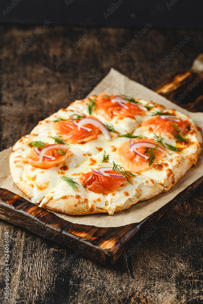 Roman-style pizzas with salmon. Roman square pizza or Pinsa on thick dough, Italian Cuisine Roman-style pizzas with salmon. Roman square pizza or Pinsa on thick dough, Italian Cuisine