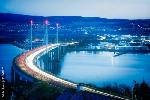 Aerial view of traffic light trails over Kessock Bridge in Inverness, long exposure photo