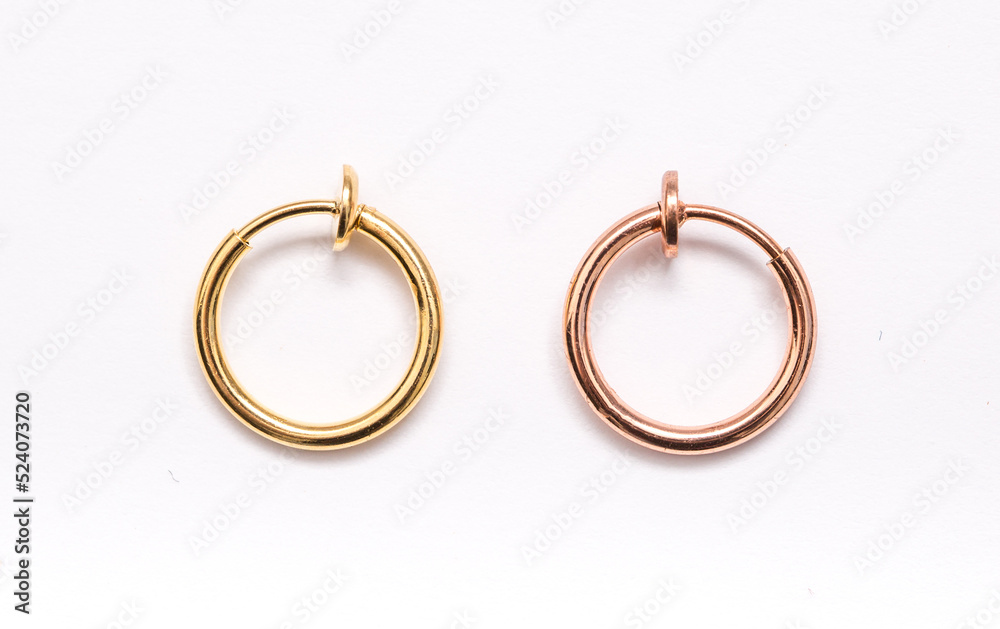 A set of jewelry for piercing on a white background. A set of earrings for the body, nose, navel, tongue, nipples, ears, various beauty jewelry, a set of cosmetological jewelry for piercing. A set of jewelry for piercing on a white background. A set of earrings for the body, nose, navel, tongue, nipples, ears, various beauty jewelry, a set of cosmetological jewelry for piercing.