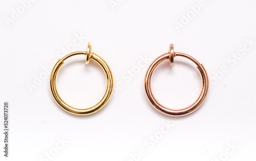 A set of jewelry for piercing on a white background. A set of earrings for the body, nose, navel, tongue, nipples, ears, various beauty jewelry, a set of cosmetological jewelry for piercing.