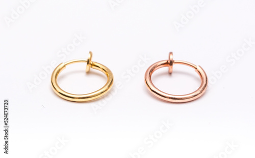 A set of jewelry for piercing on a white background. A set of earrings for the body, nose, navel, tongue, nipples, ears, various beauty jewelry, a set of cosmetological jewelry for piercing.