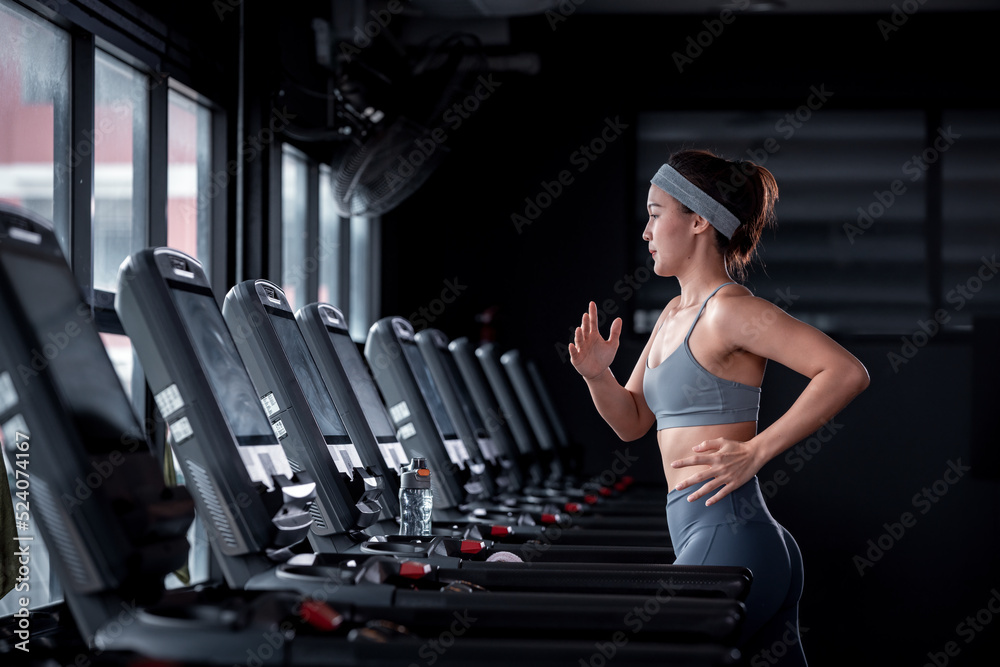 Young Fitness sport people wearing sportwear with workout headband under  exercise on treadmill machine gym is sport healthy body building in fitness  lifestyle. Stock Photo | Adobe Stock