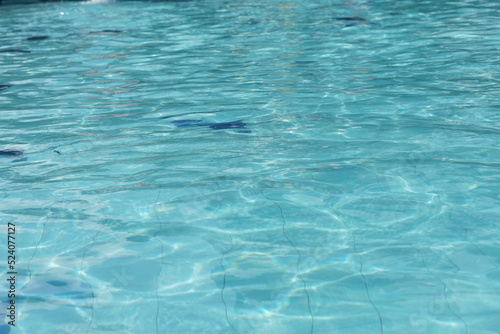 Selective focus of clear water reflection in the swimming pool