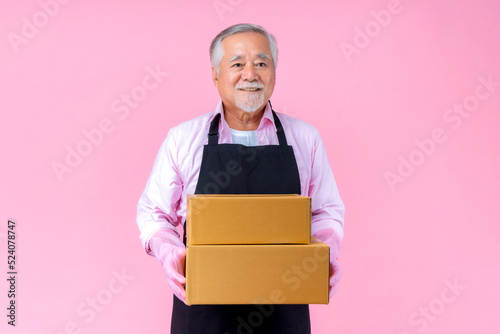 retired asian elderly man smiling holding paper box package online marketing and delivery business, Old elderly male delivery shipping service concept.