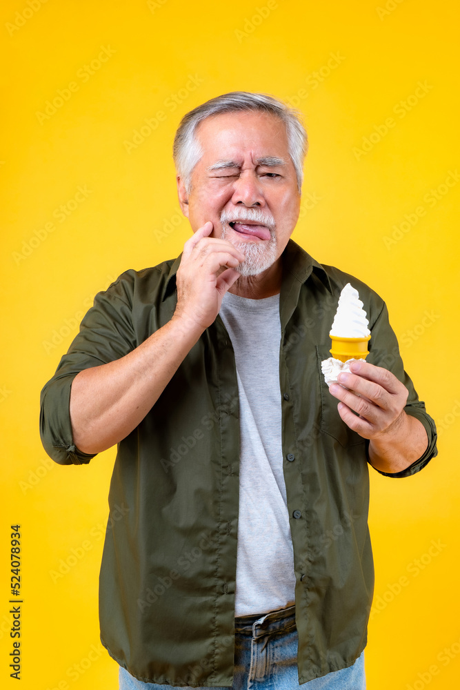 elderly men holding ice-cream, old man problem with Teeth, Desserts for elderly, Portrait Asian Senior man eating dessert Cool ice cream. elderly men holding ice-cream, old man problem with Teeth, Desserts for elderly, Portrait Asian Senior man eating dessert Cool ice cream.