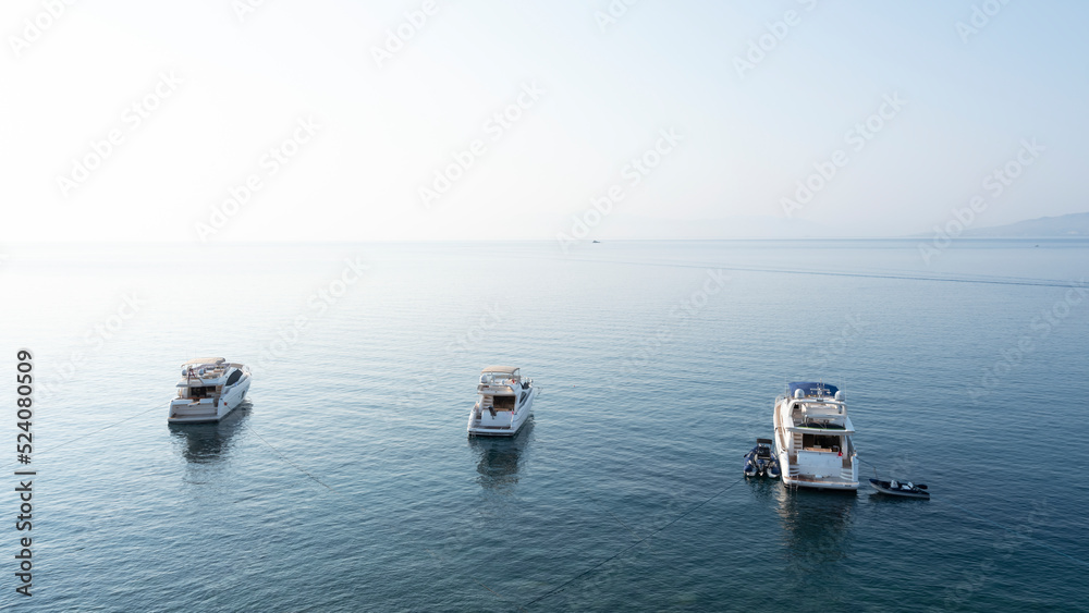 Luxury yachts in Aspat Bay, front view