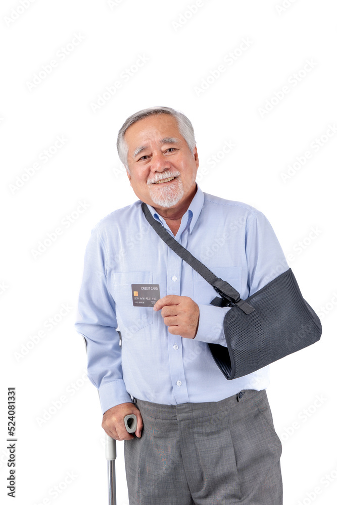 asian elderly man with hat broken arm wear arm splint for treatment and smiling and holding credit card for confident lifestyle, Old elderly male payment credit card medical care.