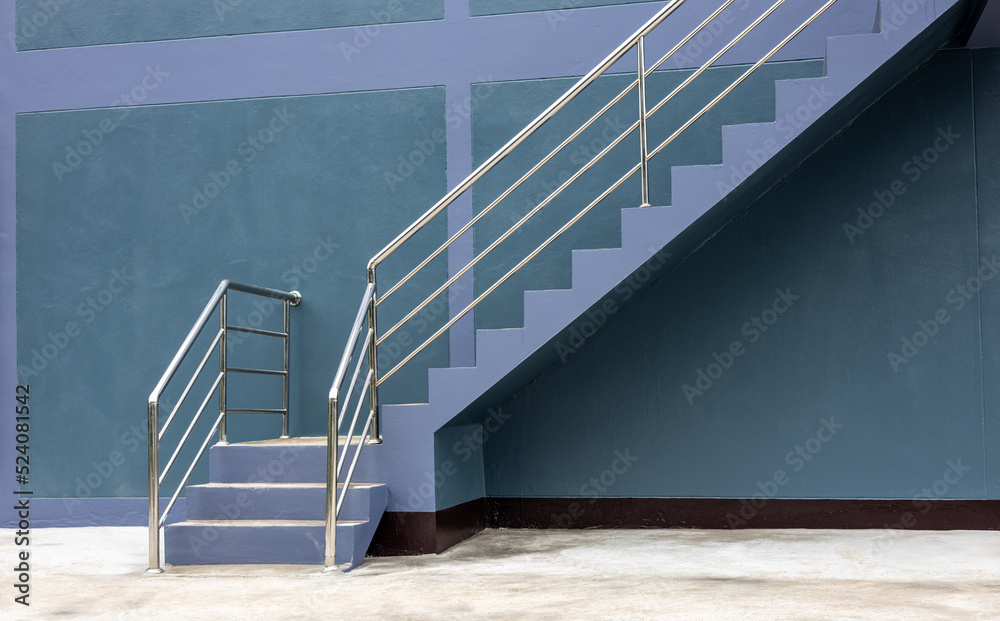 Close-up view of the background of the stairway sideways, the purple-gray wall. - obrazy, fototapety, plakaty 