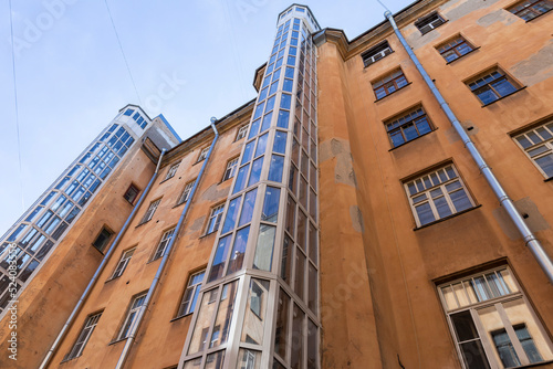 Russia. Saint-Petersburg. New elevator equipment in an old apartment building. External elevator shaft.