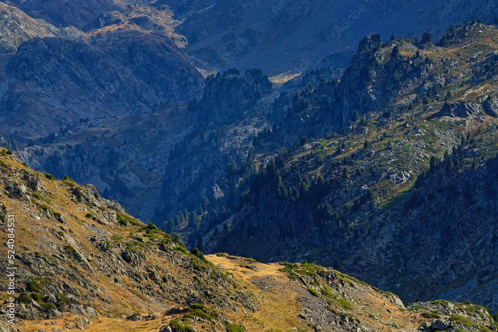 A Belledonne mountain range summer landscape with rocks; valleys and forests