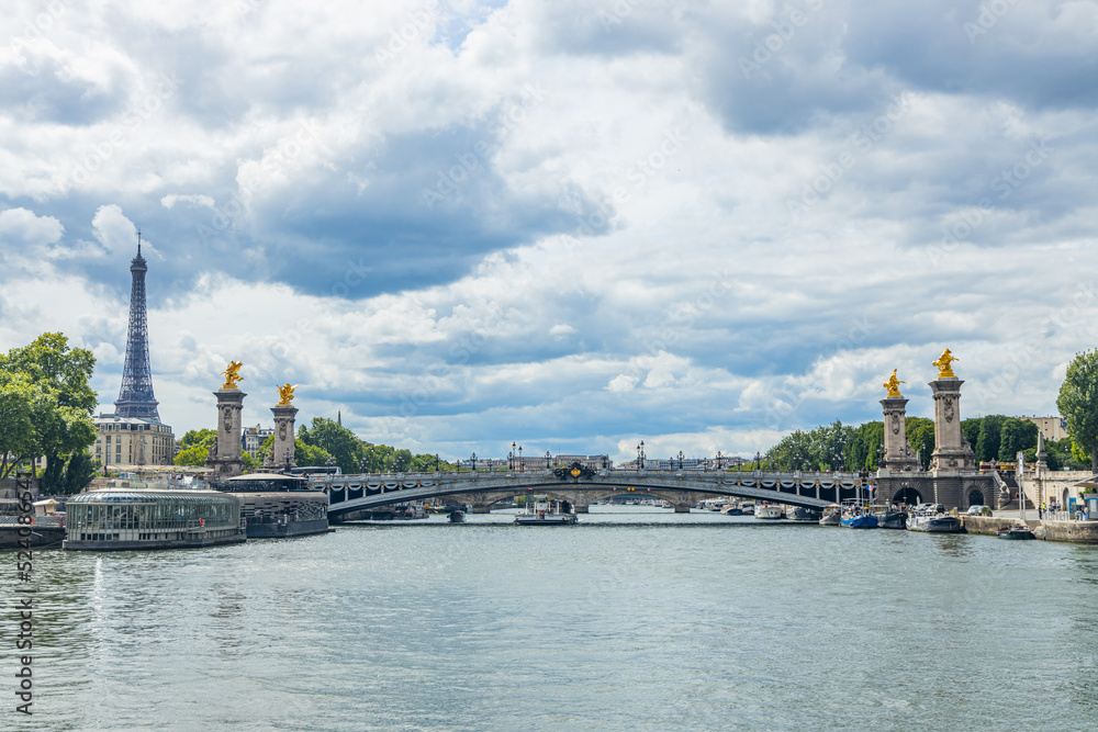 Fototapeta premium Pont Alexandre III bridge, Eiffel Tower and the Seine river in Paris, France