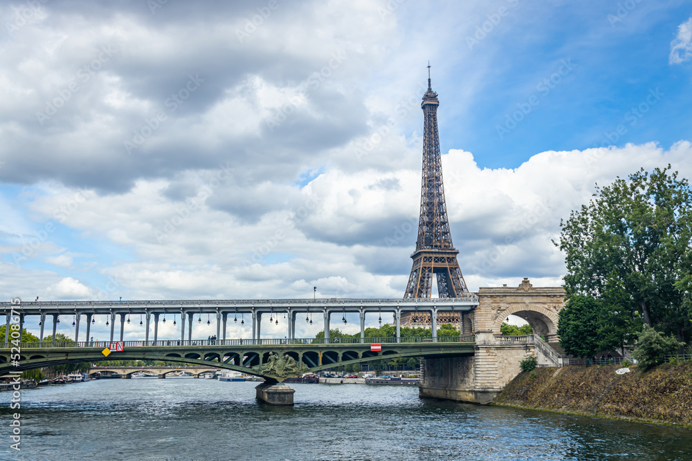 Bir Hakeim bridge and Eiffel Tower seen from a Bateau Mouche tour boat cruising on the Seine river in Paris, France