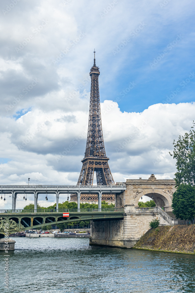 Bir Hakeim bridge and Eiffel Tower seen from a Bateau Mouche tour boat cruising on the Seine river in Paris, France