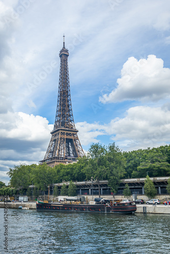 Eiffel Tower seen from a boat cruising on the Seine river in Paris, France