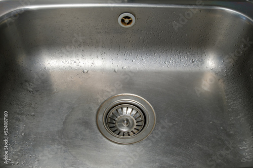 Closeup of the sink that has just been washed.