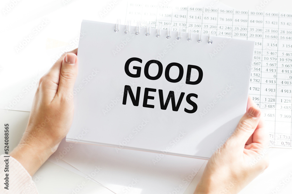 good news, hands holding paper with text concept good news, hands holding paper with text concept