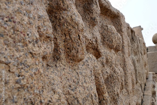 Bas relief rock cut sculptures of gods, people and animals are carved prominently in the monolithic cave temples at Mahabalipuram, Tamil nadu, India photo