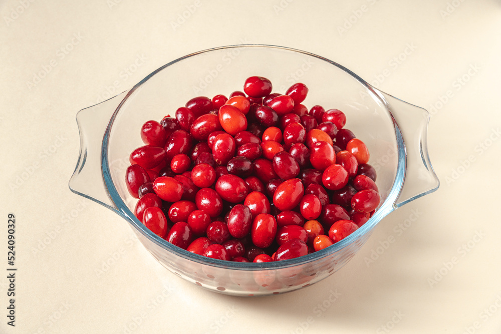 Fresh cranberries in a glass bowl. Healthy eating concept Fresh cranberries in a glass bowl. Healthy eating concept