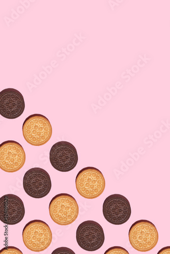 Pattern of cookies. Cookies on a white background. Flat lay. Ssandwich cookies filled with sweet cream.. weet cookies flat lay pattern on light pink background. Top view.