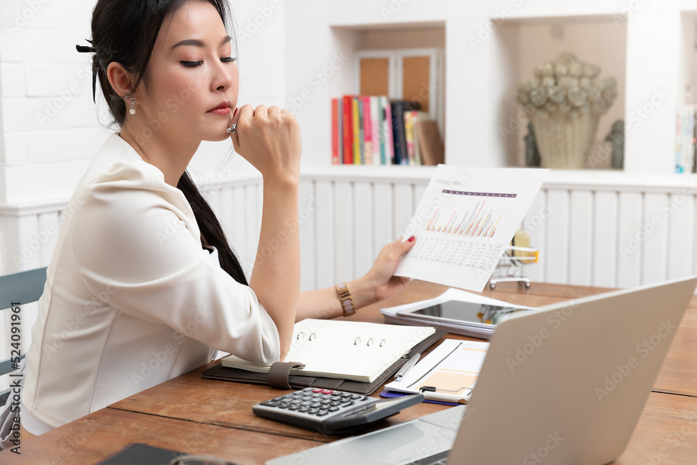Business and finance concept of office working, Businesswoman discussing sale analysis Chart Business and finance concept of office working, Businesswoman discussing sale analysis Chart