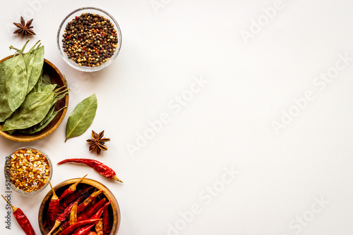 Powdered spices and herbs in bowls. Colorful cooking background