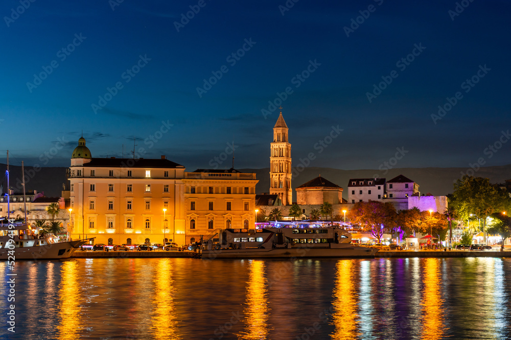 Evening city of Split in Croatia, reflection of the lights of the night city.