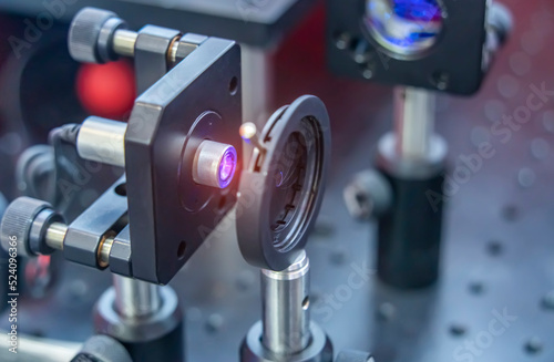 Experiment with laser device in optical laboratory