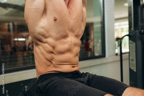 Close up on perfect abs. Strong bodybuilder