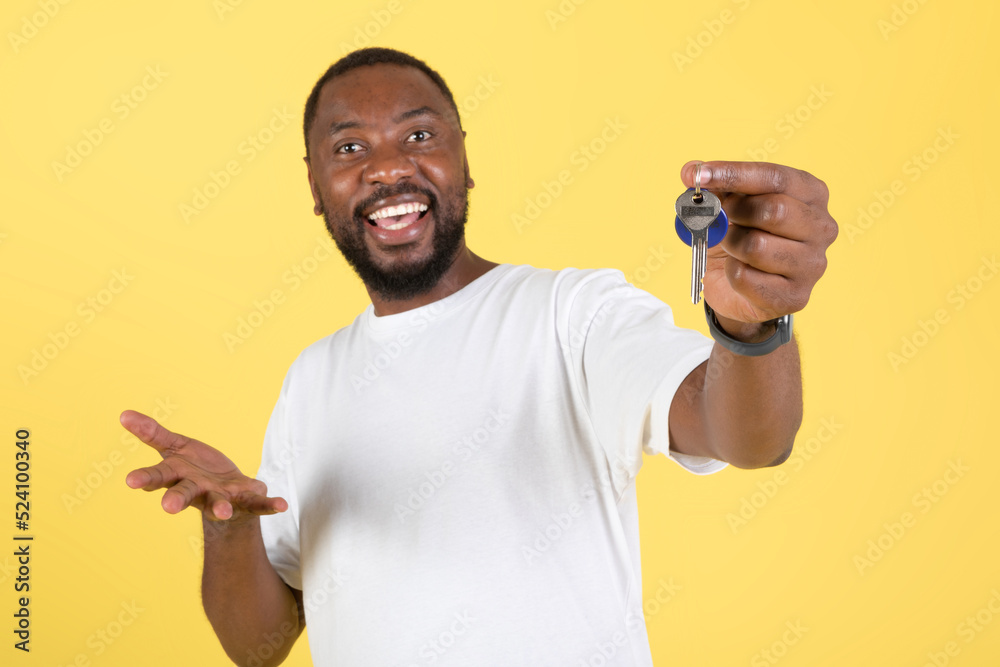 Excited Black Guy Showing Keys Buying House Over Yellow Background Excited Black Guy Showing Keys Buying House Over Yellow Background