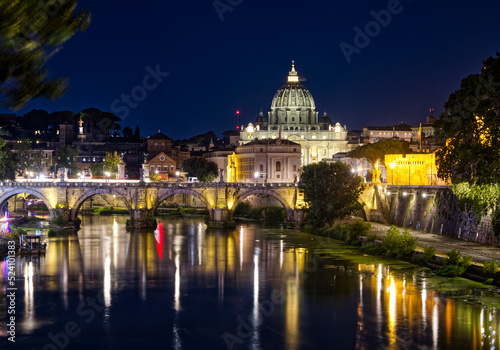 A view of Vatican City as seen from the bank of the river tiber at night.