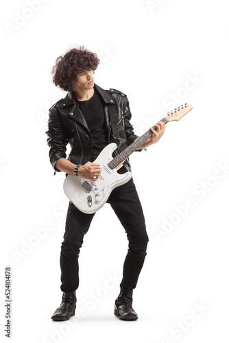 Full length shot of a man in a leather jacket playing an electric guitar