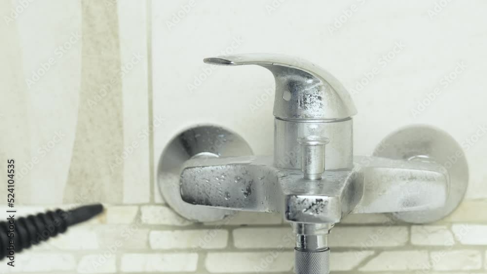 Hot wet steam cleaner Washing Tap Faucet with, in bathroom. Apartment Desinfecting House keep work cleaning concept. Hot wet steam cleaner Washing Tap Faucet with, in bathroom. Apartment Desinfecting House keep work cleaning concept.