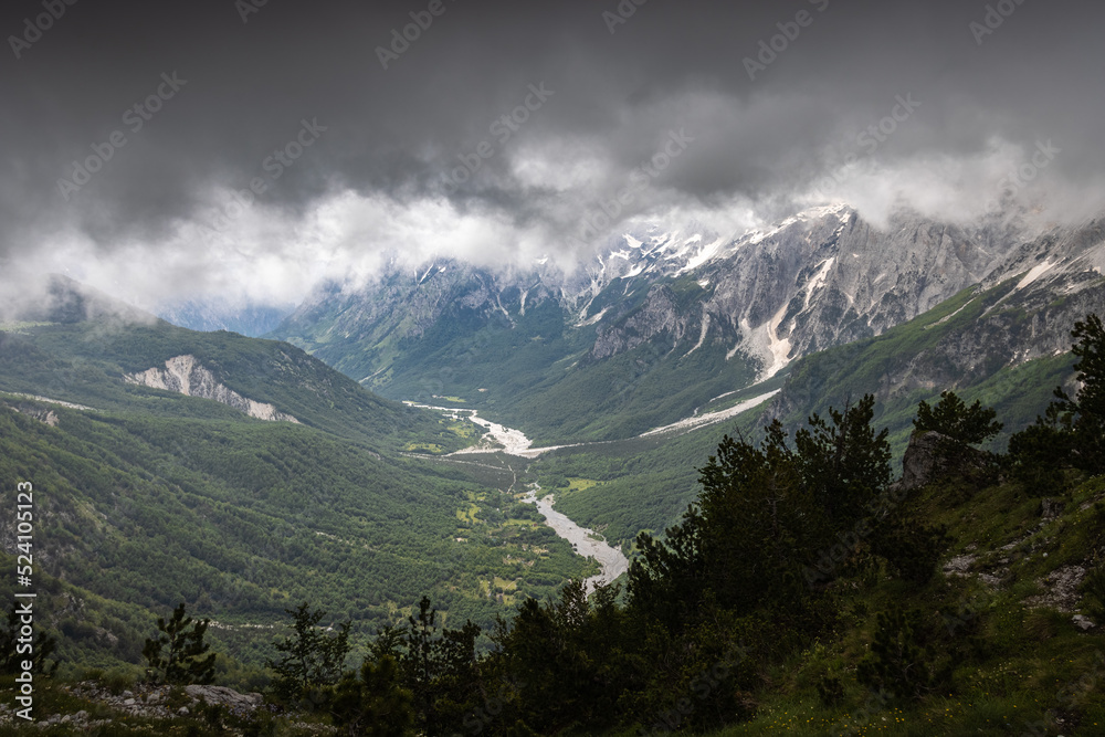 dramatic breathtaking view in the valbona valley while a strom rolls in