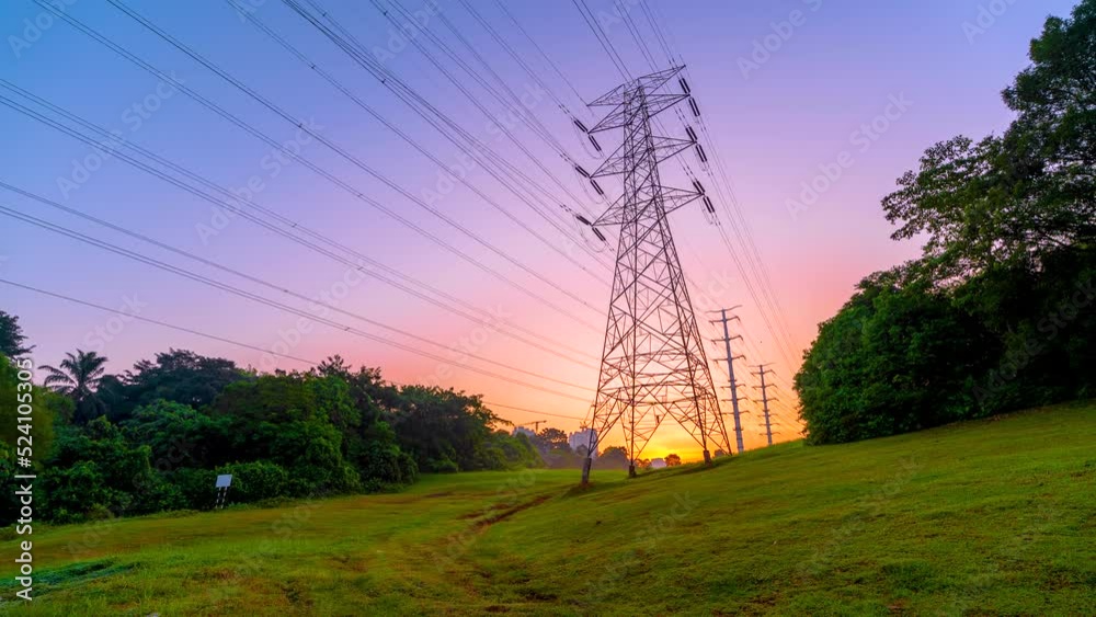 4K Timelapse sunrise of Transmission electricity steel pylon tower. Green energy sustainability and renewable concept